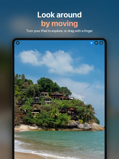 “Look around by moving — turn your iPad to explore, or drag with a finger.” The viewer on an iPad, showing houses on a hillside above a beach.